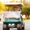 man driving golf cart in residential neighborhood