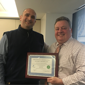 Adis Alic (left) receives Best Maintained High-rise Building Award from FirstService Residential, presented by Robert Meyer (right).